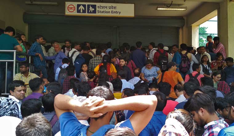 Passengers Stranded As Metro Station Entrances Remain Closed 87 Thousands stranded after snag hits Delhi Metro -