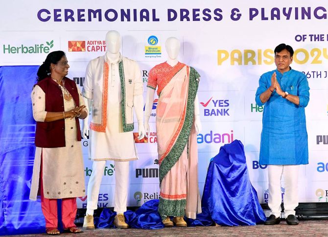 Our Olympians Deserve Better: A Peek Into India’s Olympic Dress Code Disaster 89 Union Sports and Youth Affairs Minister Mansukh Mandaviya and Indian Olympic Association (IOA) President PT Usha unveils the ceremonial dress designed by TASVA owner Tarun Tahiliani (unseen)