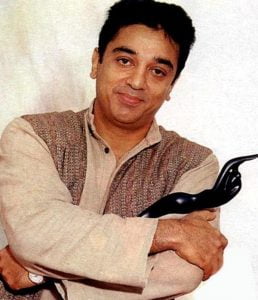 Kamal Haasan Holding His Filmfare Troophy