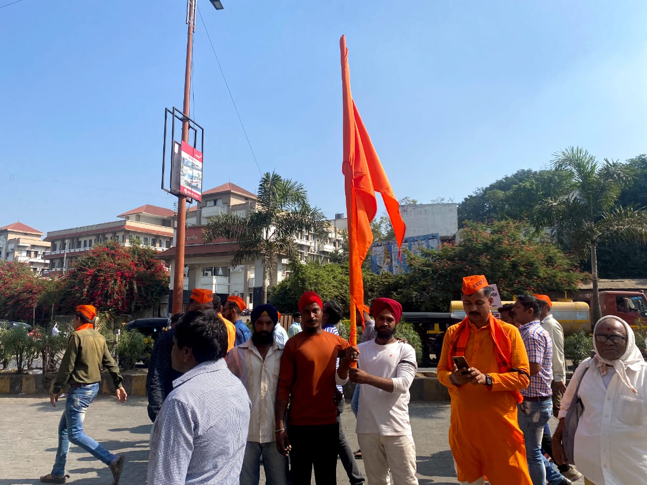 Men holding a saffron flag