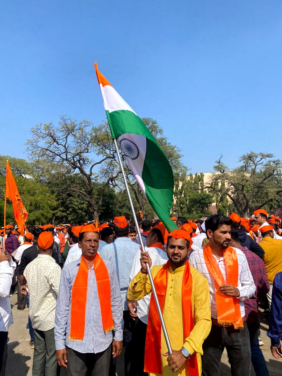 Man holding a tricolour